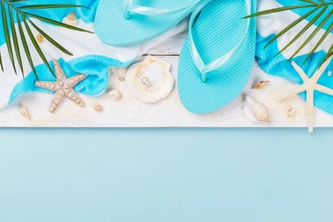 Beach accessories on the blue background Stock Photos