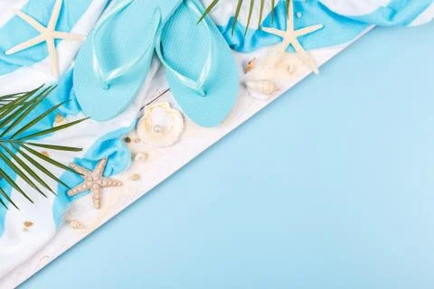 Beach accessories on the blue background Stock Photos