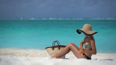 Beach accessories essentials for a summer holiday tropical vacation Stock Footage 85247180