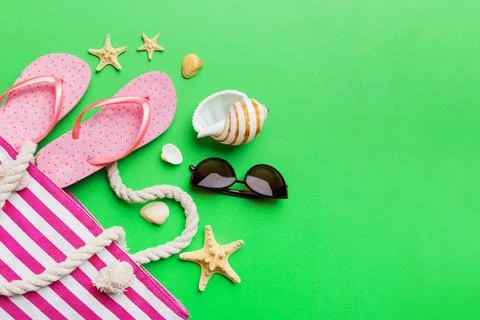 Beach accessories flat lay top view on colored background Summer travel conce Stock Photos