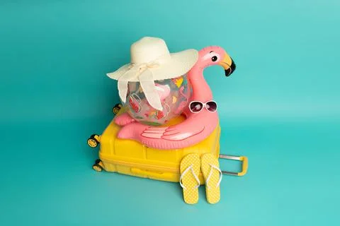 Beach accessories isolated on blue background. Travel and vacation concept Stock Photos