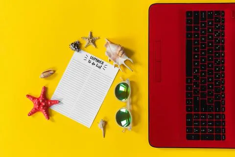 Beach accessories with summer to do list notebook, laptop computer, sunglasses Stock Photos