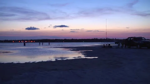 Beach activity at dusk, push-in Stock Footage 24397413