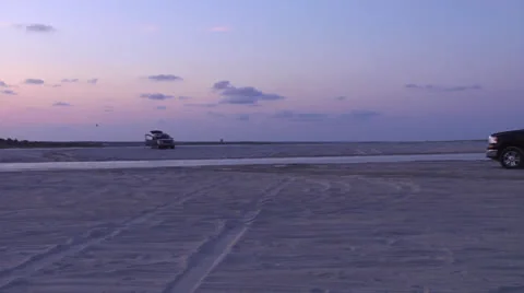 Beach activity at sunset, panning Video stock 24634715