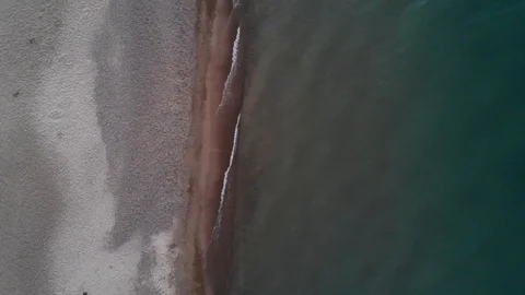 Beach Aerial With Calm Waves at Sunset Stock Footage 129762272