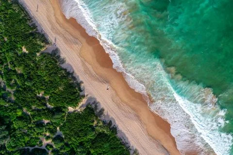 Beach aerial view drone shadow people sunrise Stock Photos