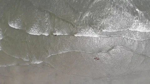 Beach Aerial Waves from Overhead Stock Footage 129762939