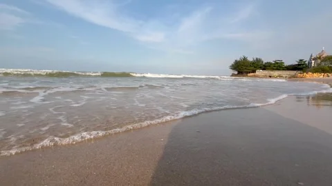 Beach in the afternoon with lapping waves Stock Footage 286854943