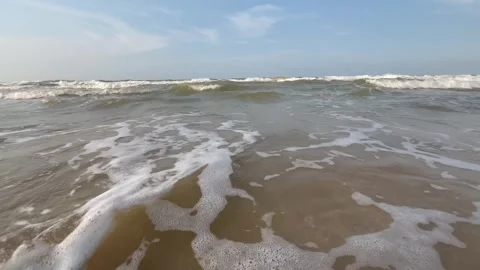 Beach in the afternoon with lapping waves Stock Footage 286854966
