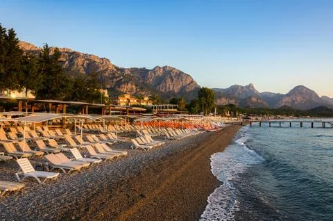 Beach against the backdrop of the mountains Stock Photos