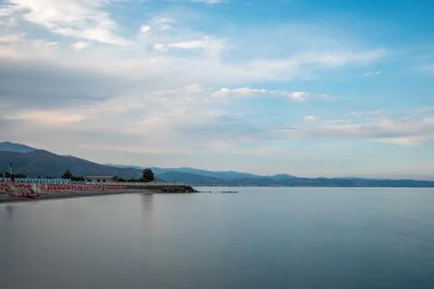 The beach of Albenga on sunset Stock Photos