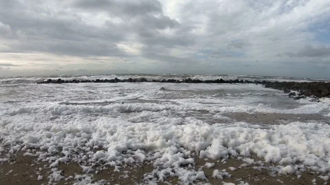 Beach with algae foam, nature experience storm Stock Footage 118229079