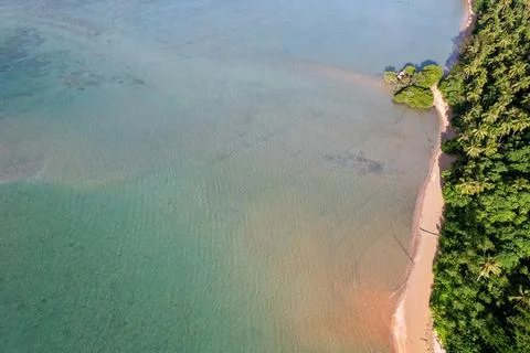 Beach and blue waters Stock Photos
