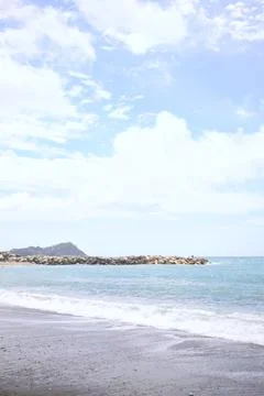 Beach and a cliff Stock Photos