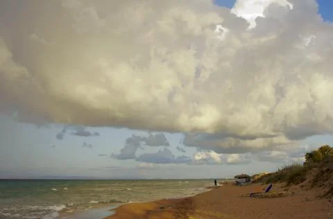 Beach and clouded sky Stock Photos