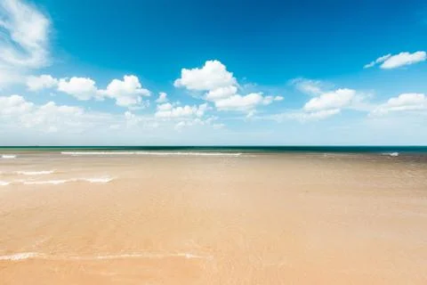 Beach and the clouds Stock Photos
