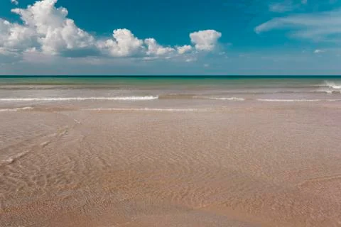Beach and the clouds Stock Photos