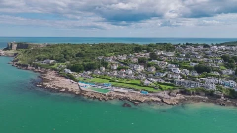 Beach and Coast over Brixham from a drone, Brixham, Torbay, Devon, England Stock Footage 247473774