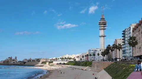 A beach and El Pirulí communication tower in Cádiz. Stock Footage 296594659