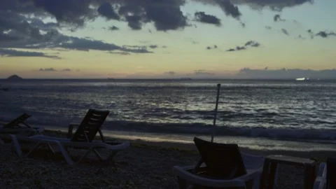 Beach and empty sunbeds at sunset. Stock Footage 169374589