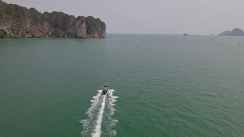 Beach and long tail boat on tropical island Stock Footage 240703423