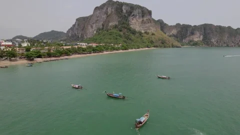 Beach and long tail boat on tropical island Stock Footage 240703442