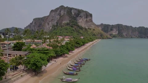 Beach and long tail boat on tropical island Stock Footage 240703483