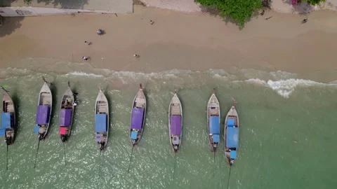 Beach and long tail boat on tropical island Stock Footage 240703486