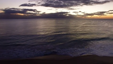 Beach and ocean at dusk tracking aerial footage - Australia Stock Footage 107270428