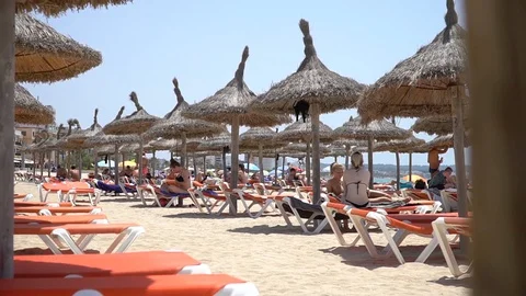 Beach and parasols Stock Footage 128349064