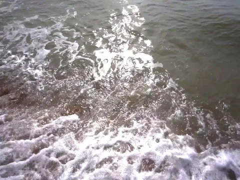 Beach and ripples waves motion before sunset Stock Footage 106533944
