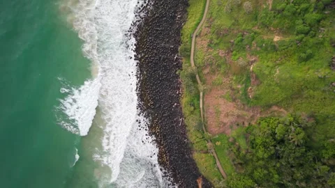BEACH AND ROCKS SEEN FROM ABOVE 스톡 동영상 325925370