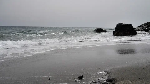 Beach and rocks with slow motion braking waves at the south coast of Crete Stock Footage 202755829