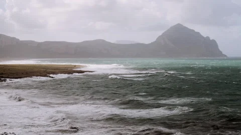 Beach and Sea Waves caressing the Rocks Stock Footage 255753318