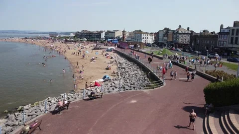 Beach and seafront at Morecambe - drone hovers stationary Stock Footage 204773966