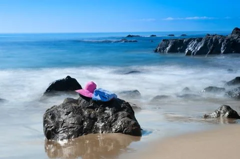 Beach and sunhat Stock Photos