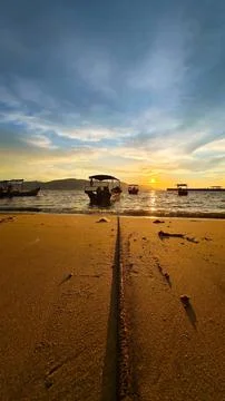 Beach and sunset Stock Photos