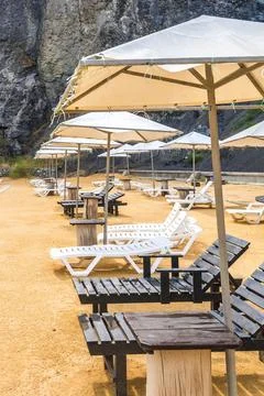 Beach and umbrellas Stock Photos
