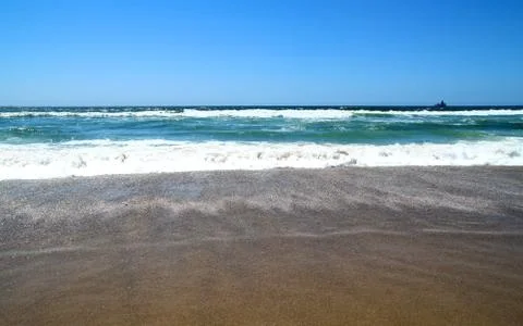 Beach and waves Stock Photos