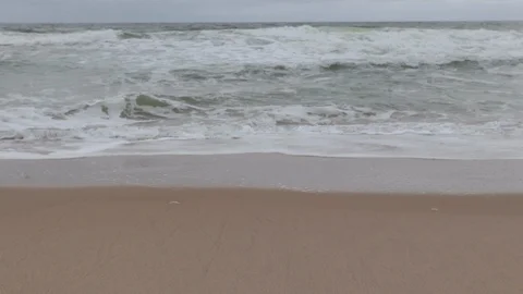 Beach and waves tilt up close overcast Stock Footage 91333516