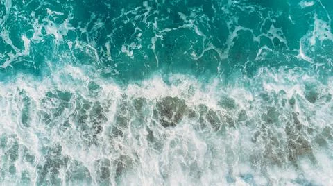 Beach and waves from top view. Turquoise water background from top view. Summ Stock Photos