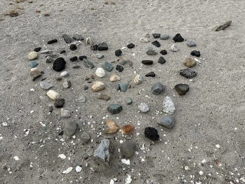 Beach art; a heart on sand Stock Photos