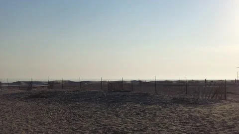 Beach Background With Fences Sparse People In Winter Left To Right Pan Stock Footage 221875111