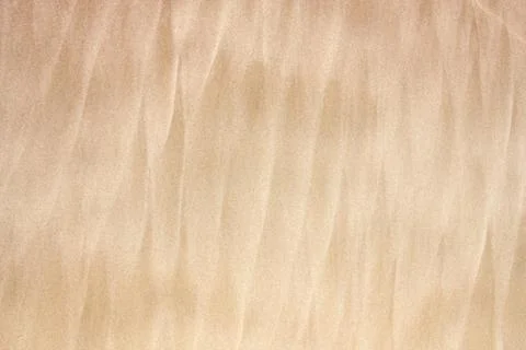 Beach background sand pattern waves. Abstract sandy texture. Stock Photos