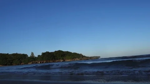 Beach in Bali on a sunny day, waves on the Indian Ocean Stock Footage 83097748