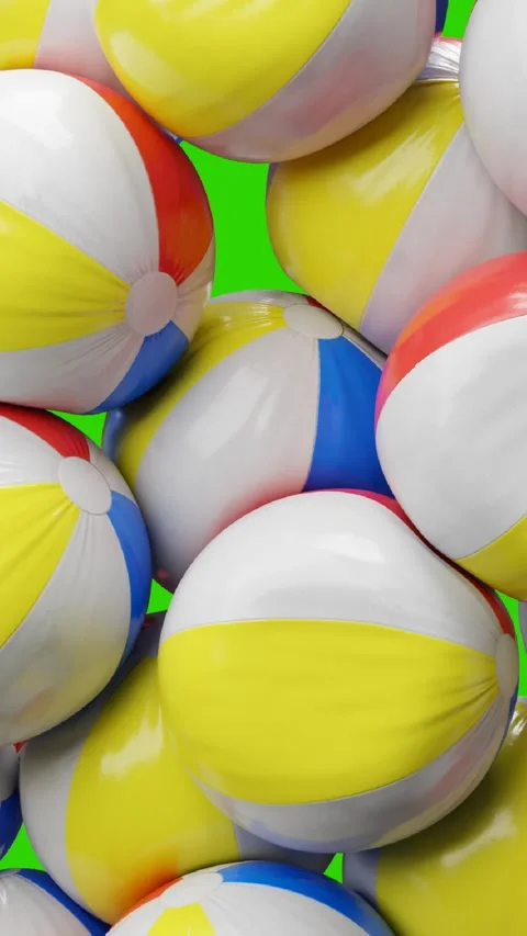 Beach balls falling on green screen Stock Footage 276662681