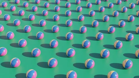 Beach balls on a green background. Rows of beach balls rolling towards Stock Footage 274297941