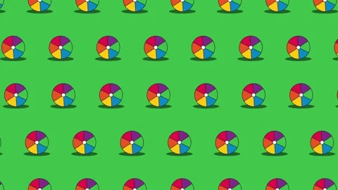 Beach balls seamless loop pattern on a green background Stock Footage 174311111