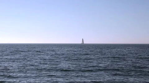 Beach on the baltic coast. Sunny day. Closeup of small sea waves. Horizon, sky. Stock Footage 155141538
