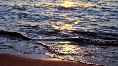 Beach on baltic sea at sunset. Sparkling sea water. Ocean waves. Close up water. Stock Footage 155185970